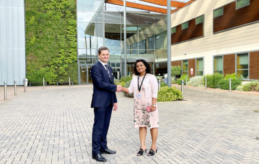 KIMS Hospital CEO, Simon James, and LycaHealth Chair, Prema Subaskaran are pictured shaking hands to celebrate the investment.