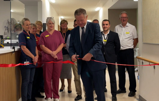 Official reopening of the wards at KIMS Hospital with a tape cutting ceremony whilst staff look on