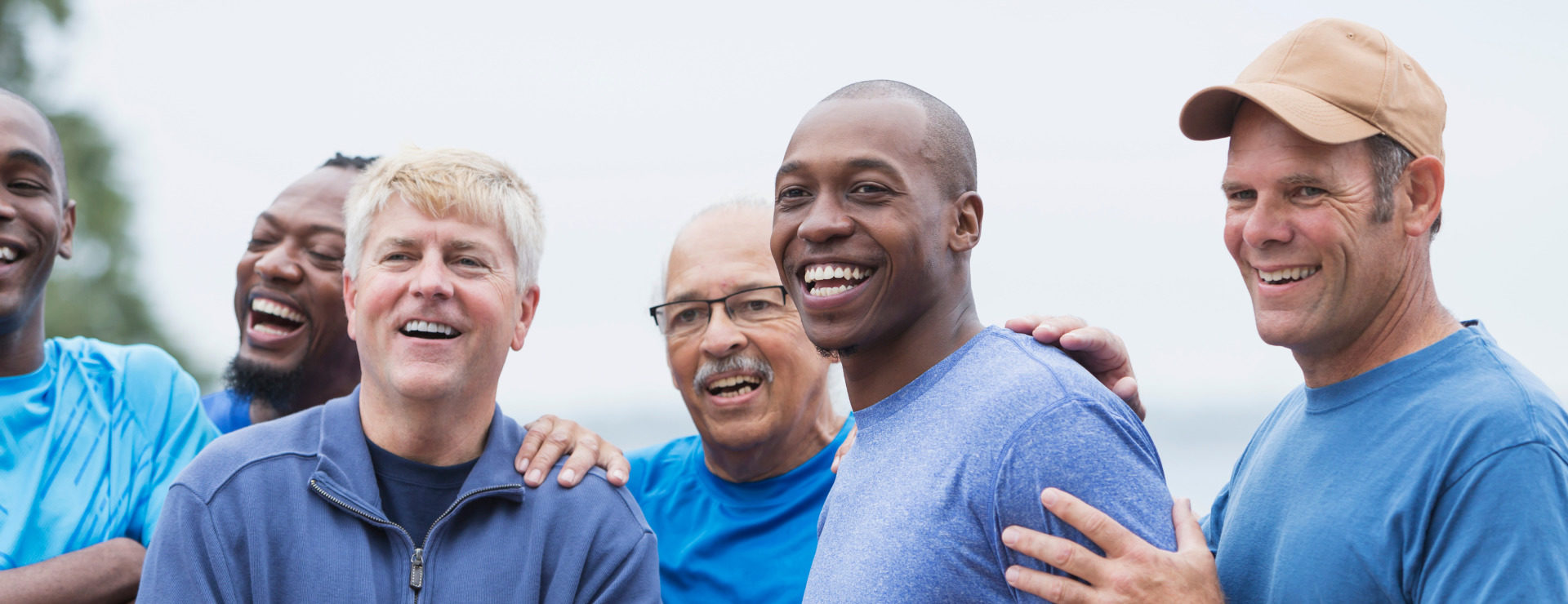 A group of men in blue shirts