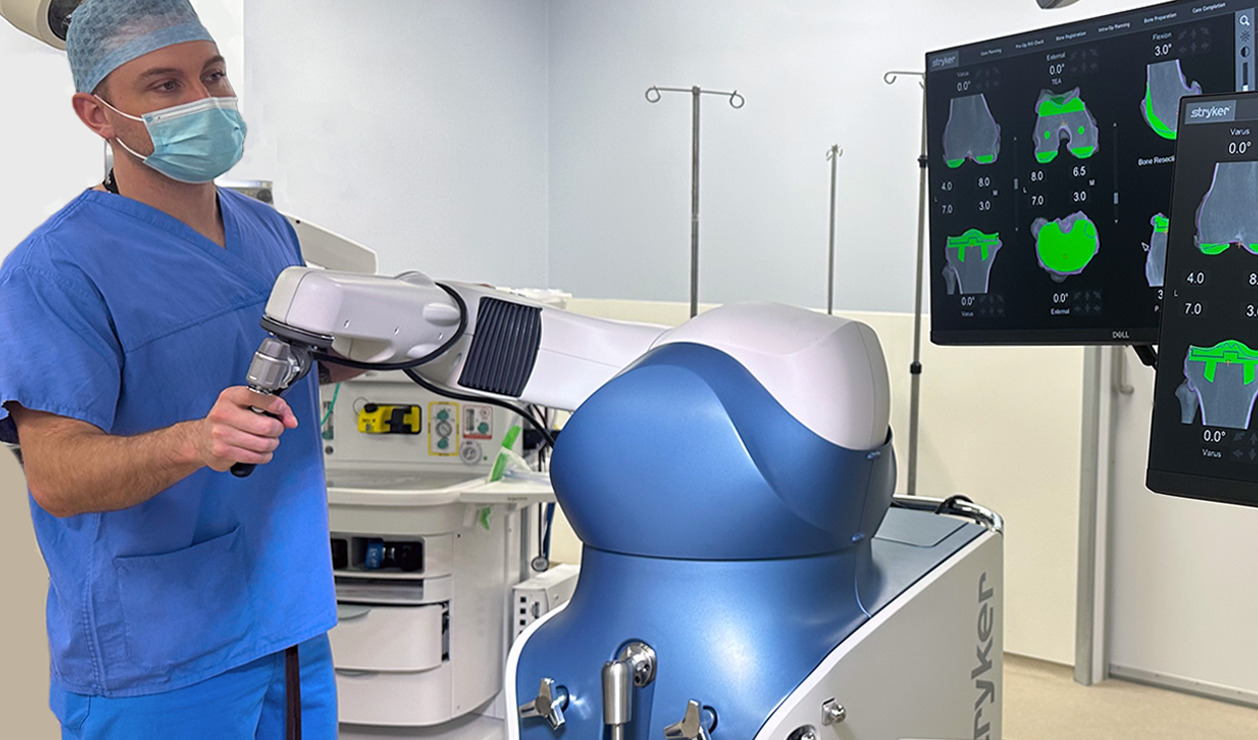 Consultant demonstrating the Mako Robotic-Arm Assisted Machine used for joint surgery at KIMS Hospital, Kent