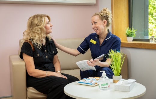 A patient being comforted by a Nurse