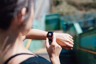 Woman checking heart rate on watch