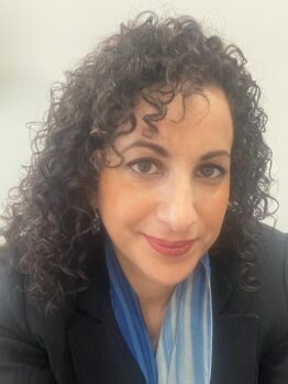 Dr Lulsegged, experienced female Private GP in London with over 20 years of medical experience, smiling in professional portrait