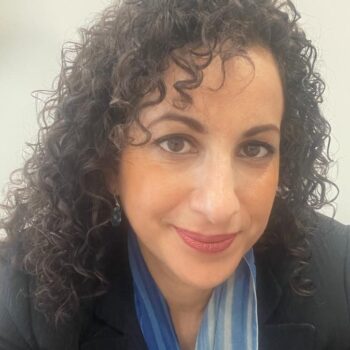 Dr Lulsegged, experienced female Private GP in London with over 20 years of medical experience, smiling in professional portrait