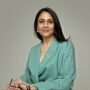 Dr Seshadri, Senior Consultant Gynaecologist and fertility specialist in the UK, expert in reproductive medicine and women’s health, smiling in professional portrait.