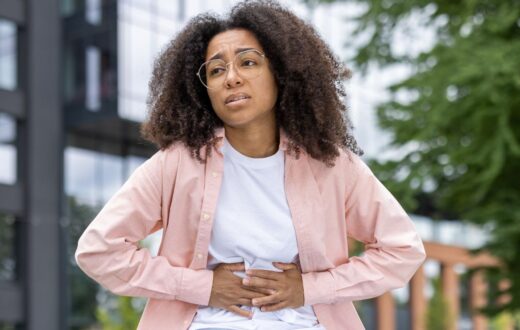 Young female experiencing stomach pain