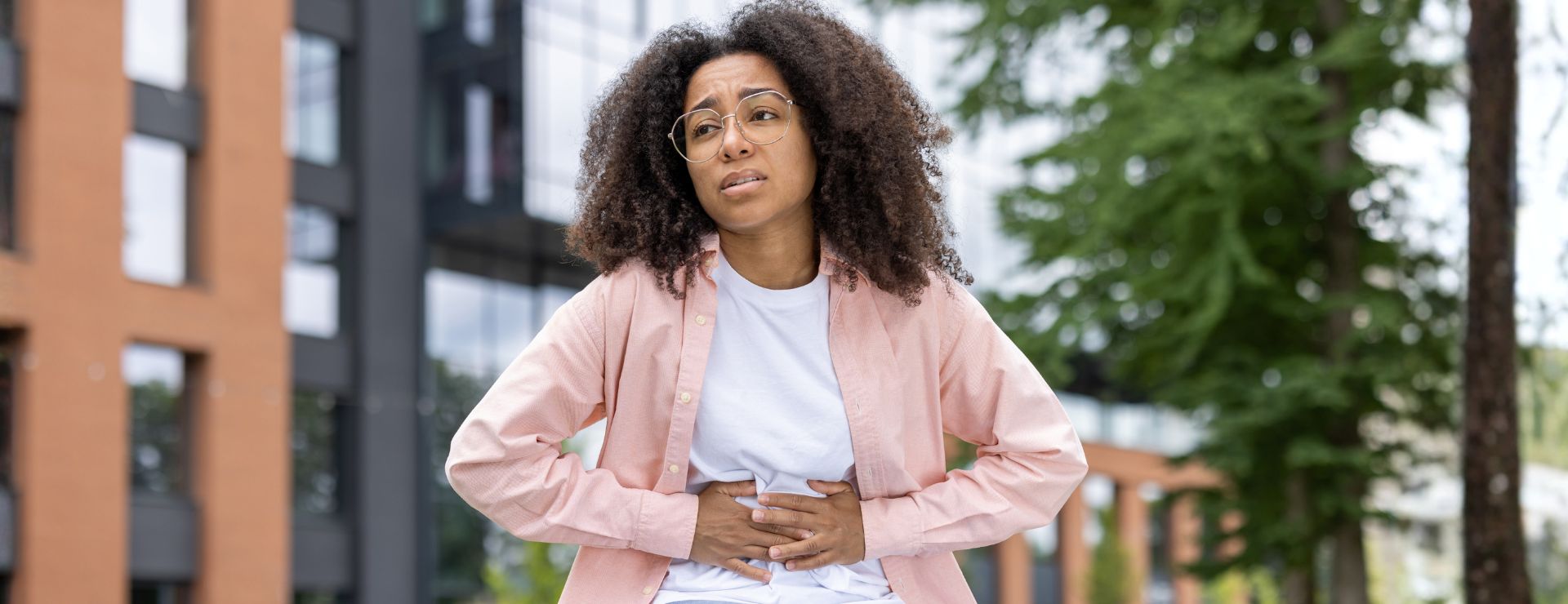 Young female experiencing stomach pain
