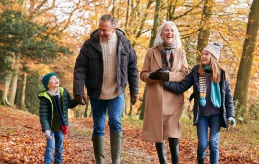 Grandparents on an autumn walk with grandchildren after orthopaedic surgery,