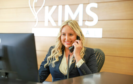 KIMS Hospital receptionist answering patient phone calls.