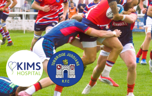 Rugby players in KIMS Hospital-sponsored Tonnbridge Juddians R.F.C. shirts compete for the ball during a match, with KIMS Hospital and Tonbridge Juddians R.F.C. logos overlaid.